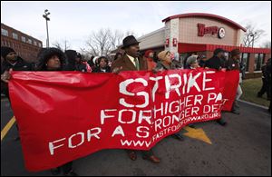 Protesters rally for better wages at a fast-food restaurant in Detroit last month.