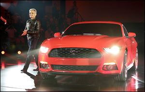 Kumar Galhotra, Ford’s vice president of engineering, global product development, presents the 2015 Mustang at the All-New Ford Mustang Global Reveal event in Shanghai on Thursday. It will go on sale in North America in the fall.