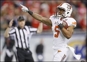 Ronnie Moore reacts after scoring on a 36-yard touchdown reception in the first quarter. Moore had four catches for 145 yards. Bowling Green handed Northern Illinois its first loss of the season.