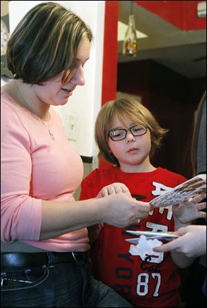 Emilee Morales, 8, and her mom Debra Ann Morales-Richards ‘adopted’ 17 Marines for the holidays.