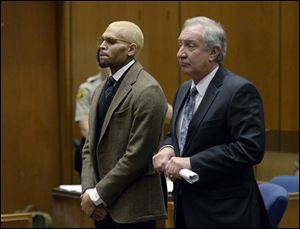 R&B singer Chris Brown, left, appears in court with his attorney Mark Geragos during a probation violation hearing in which his probation was revoked by a superior court judge Monday in Los Angeles.