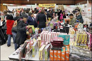 The United Auto Workers Local 12 hall on Ashland Avenue bustles with shoppers and volunteers during the Salvation Army’s annual Christmas distribution.