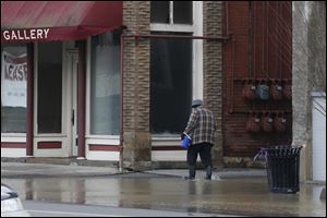 Sam Clear makes his way down North Main Street in Findlay.