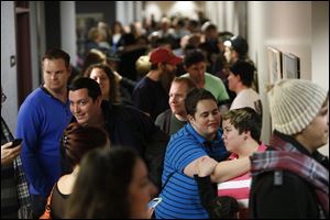 Couples wait to get marriage licenses at the Salt Lake County clerk's office today.