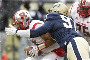 Pittsburgh’s Aaron Donald sacks Rutgers quarterback Gary Nova. He’s won most major awards for top defensive player in the nation.