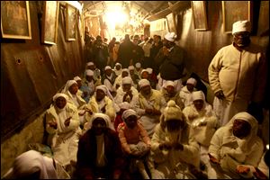 Christian worshippers from Nigeria pray at the Church of Nativity, traditionally believed by Christians to be the birthplace of Jesus Christ, in the West Bank town of Bethlehem on Christmas Eve.