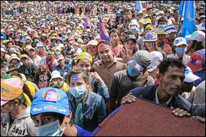 Supporters of Cambodian’s opposition party gather for a mass demonstration against Prime Minister Hun Sen Sunday at Democracy Square in Phnom Penh.