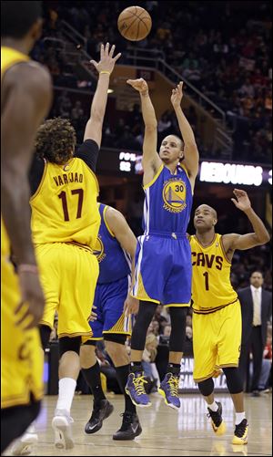 Warriors guard Stephen Curry scored 29 points and made a clutch jumper with 13.5 seconds left as the Golden State opened a long road trip with their fifth straight victory, 108-104 in overtime against the Cleveland Cavaliers on Sunday. 