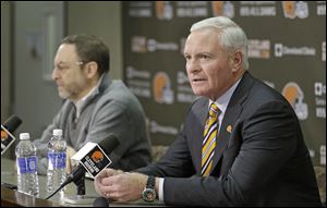 Browns owner Jimmy Haslam, right, answers questions at the Browns training facility as CEO Joe Banner listens. The two men are facing a lot of criticism for firing Rob Chudzinski after one season.