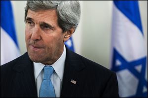 U.S. Secretary of State John Kerry, left, pauses while speaking before a meeting with Israeli Prime Minister Benjamin Netanyahu before a meeting at the prime minister's office in Jerusalem, today.