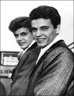 In this April 1, 1960 file photo, Phil, left, and Don of the Everly Brothers arrive at London Airport from New York to begin their European tour. 