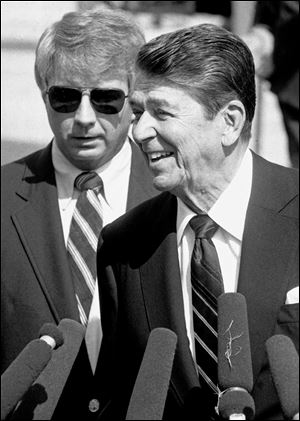 Larry Speakes, at left in this 1984 file photo, died Friday in his native Mississippi. He was 74.