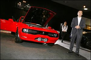 Ian James, a race-car driver who serves as ‘brand ambassador’ for Equus Automotive Inc., shows off the Equus Bass 770 at the North American International Auto Show in Detroit.