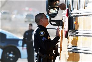 Law enforcement personnel set up a perimeter following the shooting Tuesday.