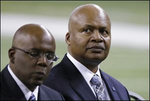 New Detroit Lions head coach Jim Caldwell, right, sits next to General Manager Martin Mayhew at Ford Field in Detroit earlier this week.