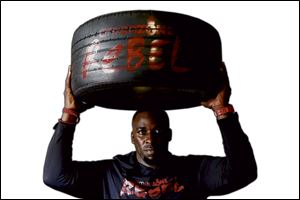 Amen Iseghohi's studio features a high-intensity workout that uses the tires as weights and steps and obstacles. 