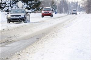 W. Sterns Rd. near Lewis Ave. on Monroe County is covered in snow on January 9, 2014.