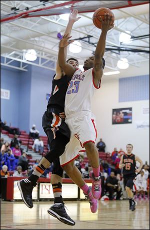 Nate Allen, who had 31 points, is fouled by Elida’s Dakota Mathias, who finished with 38 points. The Rebels are 10-1.