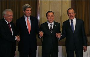 From left, UN-Arab League Envoy to Syria Lakhdar Brahimi, United States Secretary of State John Kerry, UN Secretary-General Ban Ki-moon and Russia's Foreign Minister Sergey Lavrov join hands after their international conference on ending the crisis in Syria in Montreux, Switzerland, Tuesday.