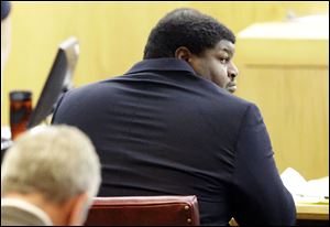 Former Dallas Cowboys player Josh Brent looks around in court during the penalty phase of the intoxication manslaughter trial in Dallas Thursday.