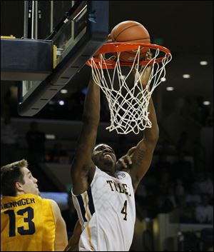 Toledo’s Justin Drummond dunks and is fouled by Kent State’s Mark Henniger. Drummond led the Rockets in scoring with 15 points, his second consecutive game leading the team.