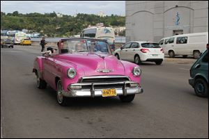 Many old cars still fill the streets in Cuba.