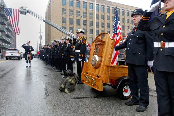 A-firefighter-rings-the-bell