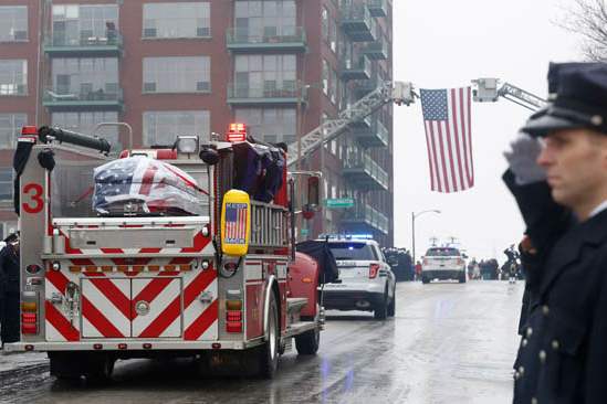 Firefighters-salute-during-the-procession