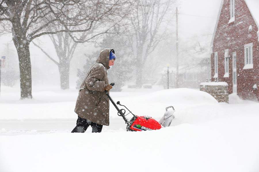 Janice-Mossing-clears-the-driveway-of-her-neighbor