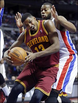 Cleveland’s Tristan Thompson, who had 25 points, pushes back against Detroit’s Greg Monroe.