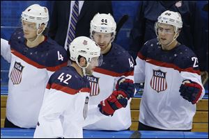 USA forward David Backes celebrates his goal against Slovakia with his teammates.