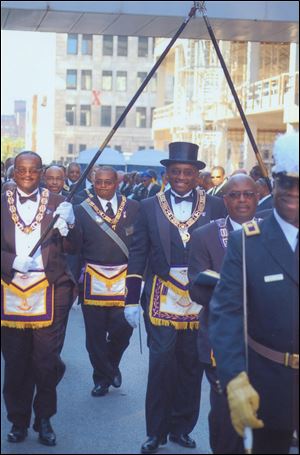 Grand Master James Willis, Sr., parades with fellow Masons in Toledo in 2006. He is also senior pastor of Toledo’s St. Paul Missionary Baptist Church.