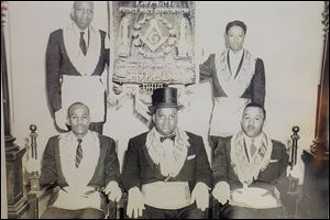 In a 1958 photograph at Amazon Lodge are, from left, J. Frank Troy, Clarence Walker, Jr., and James W. Ellis. Second row, from left, are W.W. Ballard and Carmen Williamson, who, after more than 60 years, is senior member of the Prince Hall Grand Lodge of Ohio, F&AM, in Toledo. Mr. Williamson says the lodge is the oldest chartered Masonic lodge, black or white, in Toledo. It is celebrating its 150th anniversary.