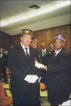 Clarence Walker, one of the most distinguished members of the Prince Hall Masonic fraternity, promotes Mayor Jack Ford to a 33rd Degree Mason in 2003. The 33rd Degree is the highest degree a Mason can attain and is a signal honor.