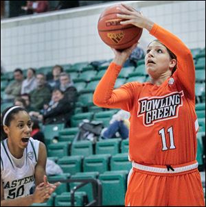 BG’s Jillian Halfhill tries a 3-pointer under pressure from Eastern Michigan's Natachia Watkins. Halfhill scored 21 points.