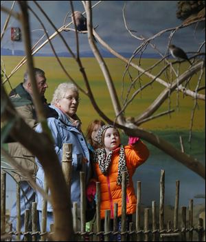 Jinnie Corthell, left, and her granddaughter Lily Hahn, 7, right;  Jim Corthell, back left, and Zoe Christian, 7, back right.