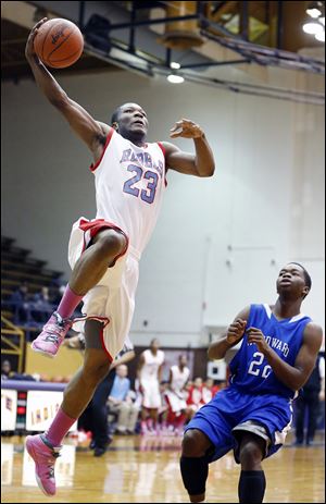 Bowsher's Nate Allen, left, goes to the net against Woodward's Anthony Bell, Jr., during a City League semifinal game. Allen had five 3-pointers and finished with 26 points.