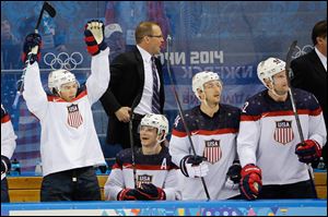 Team USA player reacts from the bench after a goal by forward Phil Kessel during the third period of men's quarterfinal hockey game against the Czech Republic today in Sochi, Russia.