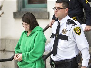 Miranda Barbour is led out of the courthouse in Sunbury, Pa. in December, 2013.