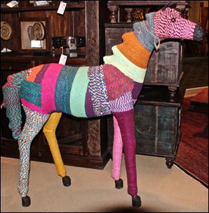 This papier mache and yarn Chindi horse is made in Nepal by Silk Route. 