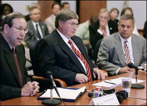 Former Ohio Gov. Bob Taft, left, appointed Rick Stansley, far right, to the University of Toledo Board of Trustees in 1999. When Mr. Stansley’s term expired in June, 2009, UT President Lloyd Jacobs, center, named him University of Toledo Innovation Enterprises chairman and later hired him to run UTIE for $1,200 a day.