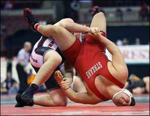 SPT wrestling02p  Jacob Hanzel of Akron Manchester turns Corey Durbin of Fremont St. Joseph Central Catholic during their Division III 285-pound championship final match at the 77th Annual State Wrestling Individual Tournament at the Ohio State University in Columbus, Saturday, March 1, 2014. Hanzel won the match. THE BLADE/ANDY MORRISON