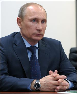 Vladimir Putin promises not to fight the Ukrainian people, easing tensions in the region next to Russia.