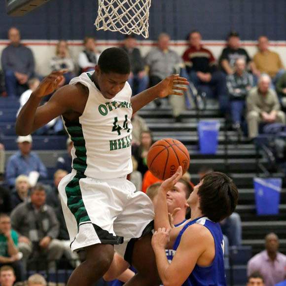 Ottawa-Hills-Ellis-Cummings-dunks-over-Tiffin-Calvert-defenders