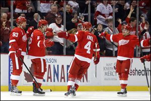 Detroit Red Wings' Brendan Smith (2) celebrates his first period goal with teammates Johan Franzen (93), of Sweden, Jakub Kindl (4), of Czechoslovakia, and Gustav Nyquist, right, of Sweden, during the first period.