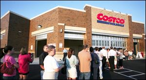 Shoppers line up for the opening of Costco Wholesale Warehouse on its first day in West Toledo in 2007. The Issaquah, Wash., chain had $103 billion in sales last year from 462 U.S. stores and more globally.