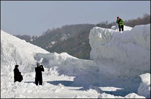 Lake Michigan’s frozen waters and snow draw photographers to the shore of northern Leelanau County between Northport and Leland. The ice ridges were several hundred feet from shore.