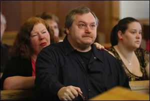 James Spaulding, father of Beth Spaulding Risenburg, 31,reacts during the sentencing of Jason Risenburg. Risenburg pleaded guilty to involuntary manslaughter in his wife's death.