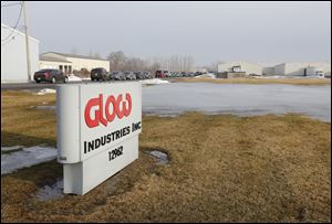 Law enforcement vehicles are parked outside Glow Industries Inc. in Perrysburg.