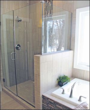 The beautiful master shower is next to an extra deep soaking tub.